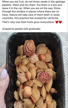 someone is holding up a container filled with nuts and other things to eat on valentine's day