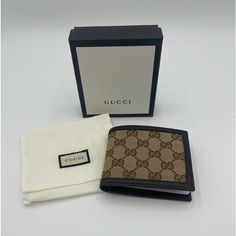 Gucci Gg Canvas Brown/Beige Leather Bifold Wallet 260987 Ky9ln 9903 This Is A Wonderful Gucci Bi Fold Wallet. It Is Made Out Of Canvas With Leather Trim, And Is The Perfect Size. Men And Women Will Find Joy In Being Able To Keep The Essentials Close With This Awesome Wallet. Gucci Original Gg Canvas Leather Men's Bifold Wallet 260987 Ky9ln 9903 Brown/Beige Material: Canvas With Leather Trim Measures 4.5 Length X 3.5 Height Inches 6 Credit Card Slots, 2 Bill Slots, Embossed Gucci Trademark And Mo Classic Gucci Wallet For Travel, Classic Gucci Travel Wallet, Designer Brown Rectangular Wallet, Gucci Brown Formal Wallet, Designer Beige Wallets For Gift, Designer Beige Wallets As A Gift, Designer Beige Wallets For Gifts, Designer Beige Wallets As Gift, Formal Brown Gucci Wallet