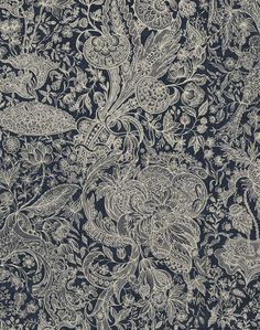 an intricately designed wallpaper with blue and white flowers, leaves and swirls