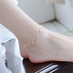 Show off your pedicure and add touch of light-catching shine to your ensemble with this elegant anklet plated in gleaming sterling silver. 0.35'' W x 9.84'' L S-hook clasp Fine silver-plated copper