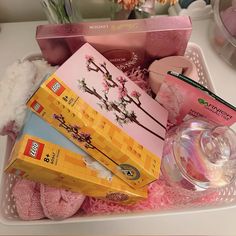 a basket filled with lots of different types of items on top of a white table