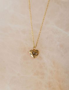 The Land of Salt Heart Amulet Necklace Gold Heart Necklace With Cable Chain For Valentine's Day, Valentine's Day Gold Heart Necklace With Cable Chain, Gold Heart Necklace With Cable Chain For Gift, Gold Heart Necklace With Cable Chain As Gift, Dainty Gold Heart Necklace With Cable Chain, Gold Delicate Chain Necklace For Anniversary, Gold Heart Necklace With Birthstone In Dainty Style, Gold Heart Necklace With Birthstone, Dainty Style, Gold Dainty Heart Necklace With Birthstone