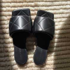 Bottega Veneta Womens Padded Lio Sandals In Black Size 36 Eu (Same As Us Size 6), Brand New - Only Worn Once - No Scuffs On Bottom, Pristine Condition (The Only Small Sticky Part On The Bottom Of Shoe Is From Taking The Sticker Off!) Item Info Quilted Lambskin Slip-On Sandals In Black. Square Toe Logo Embossed At Tonal Padded Nappa Footbed Leather Outsole In Tan With Rubber Injections Supplier Color: Black Upper: Lambskin. Sole: Leather, Rubber. Made In Italy. Black Slip-on Sandals With Padded Heel, Black Evening Sandals With Cushioned Footbed, Black Cushioned Evening Sandals, Black Cushioned Sandals For Evening, Evening Flat Sandals With Padded Heel, Black Flat Heel Sandals With Padded Heel, Designer Sandals With Padded Flat Heel, Designer Black Sandals With Square Toe, Designer Black Square Toe Sandals