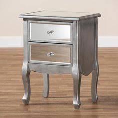 Baxton Studio Leonie Modern Transitional French Brushed Silver Finished Wood and Mirrored Glass 2-Drawer Nightstand FredCo theFredCo Silver Nightstand, Glass Nightstand, Transitional Nightstand, Bedside Essentials, Glam Chic, Crystal Knobs, 2 Drawer Nightstand, Mirrored Nightstand, Wood End Tables