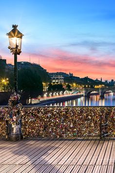 the bridge is covered in padlocks and locks