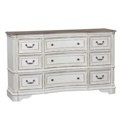 an old white dresser with drawers and knobs