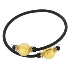 Adorn your wrist with this lovely Murano Glass bracelet - a great reflection of Venice with its trendy present and opulent past. A simple black band connects gorgeous Murano beads in rich colors lined with 24ct gold foil. This Venetian bracelet handcrafted by Murano Glass artisans using ancient glass-making techniques makes a wonderful gift for any style-conscious woman. Each round bead measures just under 1/2 inch in diameter, the connector is rubber-covered wire, which adjusts to a variety of Elegant Stretch Bracelet For Party, Elegant Black Bead Round Bracelets, Elegant Gold Bracelets With Black Beads, Elegant Black Beads Bracelet For Formal Occasions, Elegant Black Beaded Bracelets For Formal Occasions, Adjustable Gold Jewelry With Black Band, Elegant Black Bead Stretch Bracelet For Parties, Elegant Black Beaded Bracelets As Gift, Elegant Black Beads Stretch Bracelet