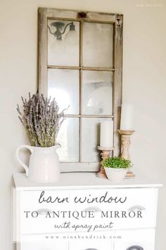 an old window frame is used as a sign for the front door to this antique mirror