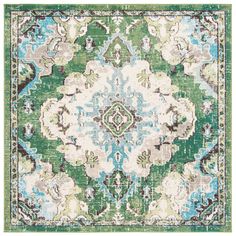 a green and blue rug with an ornate design