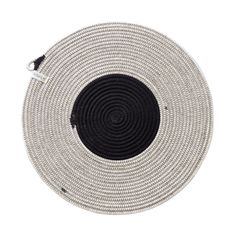 a round black and white placemat on a white background