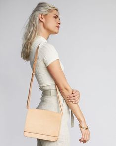 Ships in 3-5 business days• 9.5" W x 7.5" H, 2" D• Natural Vachetta leather• Magnetic closure• Adjustable crossbody strap• 19.5" - 23" strap length• Interior zipper pocket• Handmade in an ethical factory in León, Mexico Elegant, simple, and understated, you'll want to carry the Clara Crossbody purse all around town. With its structured, clean lines and smooth black leather, Clara is sure to make you stand out in the best way possible. Nisolo is committed to delivering effortless style that’s roo Classic Leather Satchel For Spring, Adjustable Leather Shoulder Bag For Everyday, Spring Leather Satchel With Adjustable Strap, Classic Leather Shoulder Bag For Spring, Modern Natural Leather Satchel, Versatile Leather Shoulder Bag In Natural Color, Versatile Leather Satchel For Spring, Adjustable Shoulder Bag For Everyday Use, Bags Photoshoot Ideas