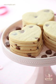 cookies with chocolate chips arranged on a cake platter for valentine's day desserts