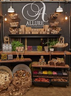 an allure store filled with lots of fresh produce and baskets full of vegetables on the counter