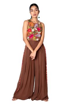 Brown jumpsuit with floral embroidered bodice, side-cutout and flared bottoms.
Component: 1
Embroidered
Neckline: Round
Sleeve Length: Sleeveless
Fabric: Georgette
Color: Brown
Sequin work - Aza Fashions Embroidered Fitted Sleeveless Jumpsuits And Rompers, Sleeveless Sets With Floral Embroidery For Party, Sleeveless Embroidered Georgette Sets, Embroidered Sleeveless Georgette Sets, Festive Sleeveless Jumpsuits And Rompers, Festive Embellished Sleeveless Jumpsuits And Rompers, Sleeveless Sets With Floral Embroidery For Reception, Brown Jumpsuit, Flared Bottoms