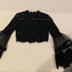 Beautiful Black Lace Top With Flattering Flared Sleeves. Brand New Condition. Size: Xs Black Long Sleeve Tops For Going Out, Black Top For Going Out In Winter, Winter Going Out Black Top, Edgy Long Sleeve Tops For Going Out, Black Lace Top, Fashion Nova Tops, Black Lace Tops, Lace Tops, Flared Sleeves