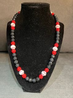 Grab this custom Baseball beaded necklace.  Red black and custom baseball beads, a classic one and only design  20in w/ magnetic clasp for easy and comfort. Elevate your style AND your game with our vibrant, handcrafted beaded necklace.   Look Good, Feel Good, Feel Good Play Good! BLING BLING ⚾️🏈⚽️🏀⚾️️ 📿 Baseball Football Soccer Softball Basketball 🌟 Features Versatile Design 🌟 Unique Design 💎 Quality Matters: Thick Elastic band and magnetic clasps ensure durability and long-lasting wear.  You will not see this band and clasp anywhere else. 📸 Instagram-Ready: Be prepared for compliments and photo ops wherever you go! Follow @DingerCityDrip Black Silver White Cross Beaded Necklace Fruit Loop Phillies Yellow Orange Green Teal Rhinestone Bead Beaded Chain Blue Pink Red Green Baseball W Black Necklaces With Round Letter Beads, Black Beaded Necklace With Letter And Round Beads, Black Beaded Necklace With Letter Beads, Casual Red Jewelry With Black Beads, Baseball Necklace, Custom Bling, White Cross, Necklace Red, White Crosses