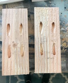 two pieces of wood with holes in them