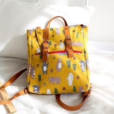 Trendy Rectangular Backpack, Trendy Yellow School Backpack, Daily Use Softback Backpack With Adjustable Strap, Trendy Canvas Travel Backpack, Large Capacity Tote Backpack For Back To School, Trendy Tote-style Backpack For School, Large Capacity Back-to-school Backpack, Trendy School Tote Backpack, Casual School Tote Backpack