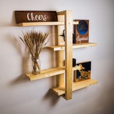 the shelves are made out of wood and have different types of items displayed on them