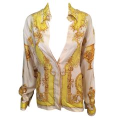 GIANNI VERSACE Vintage Sexy Plunging Decollete Silk Shirt Top IT 44 Versace vintage long sleeve blouse featuring print throughout, pointed collar and concealed button closures at front. About Versace: Founded in 1978 by the late Gianni Versace, this Italian design house specializes in sizzling glamour. Gianni's sister, Donatella Versace, has designed the label since 1997, creating luxuriously sexy dresses and separates. The line also includes shoes and a range of fragrances. Luxury V-neck Top For Spring, Luxury Printed Blouse For Spring, Designer Long Sleeve Summer Tops, Luxury Long Sleeve Printed Blouse, Designer Long Sleeve Tops For Summer, Elegant V-neck Printed Shirt, Designer Silk V-neck Tops, Luxury Long Sleeve Tops For Summer, Designer V-neck Summer Blouse