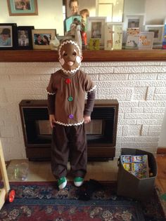 a man in a clown costume standing next to a phone