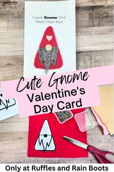 valentine's day card with scissors and other crafting supplies on a wooden table