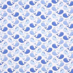 a blue and white pattern with whale's on it