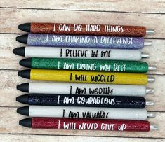 six pens with writing on them are lined up in a row and the words i can do