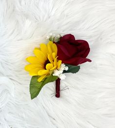 a bouquet of sunflowers and other flowers on white fur