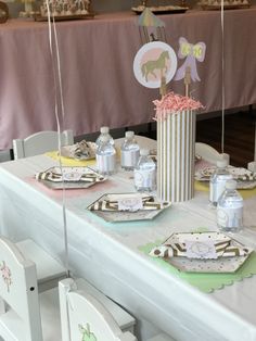 a table set up for a baby's first birthday party