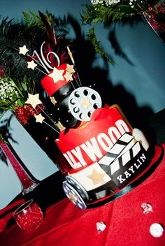 a red and white cake sitting on top of a table