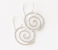 "These silver spiral earrings are simple and whimsical. They can be dressed up or down and inspire the celebration of life and freedom in the wearer. Each pair of swirls is sterling silver- no two pairs are alike. The spiral is a powerful symbol and has many meanings- balance, direction, initiation, centering- just to name a few. As an artist, creating spiral jewelry mimics the occurrence of the spiral in nature. Additionally, I have been inspired by spirals on canyon walls in the Southwest- and Spirals In Nature, Spiral Jewelry, Mixed Metal Jewelry, Spiral Earrings, Earring Tree, Recycled Silver, Metal Earrings, Jewelry Gift Box, Celebration Of Life