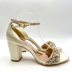 Badgley Mischka Women's Finesse Jewel Embellished Ivory Satin Block Heels. Model /Style Number Mp4629. Women's Size 7.5. Condition: New In Box; Box Has Wear. Minor Marks On Leather Soles As Pictured. New To Poshmark? Sign Up Using Invite Code: Tentoday For $10 Off Your Purchase! Crystal And Flower Embellishments Add Dreamy Romance To An Ankle-Strap Sandal Set On A Classic Block Heel. - Heel Height Measurement In Photos - Adjustable Ankle Strap With Buckle Closure - Textile Upper/Textile And Synt Elegant Embellished Block Heel Wedding Shoes, Glamorous Cream Heels For Evening, Cream Embellished Party Heels, Party Cream Embellished Heels, Champagne Embellished Open Toe Wedding Shoes, Glamorous Cream Formal Heels, Champagne Embellished Ankle Strap Wedding Shoes, Embellished Cream Heels For Evening, Champagne Embellished Wedding Shoes With Ankle Strap