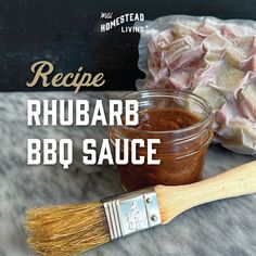 the recipe for rhubarb bbq sauce in a jar with a brush