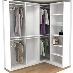 an open closet with clothes and handbags hanging on the rack, in front of a white wall