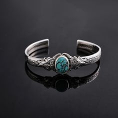 This stunning Silver Medieval bracelet is the perfect gift for any special occasion, especially as a unique birthday gift. Adorned with a vibrant turquoise gemstone, this bracelet exudes elegance and charm. Handcrafted with intricate details, this piece is sure to make a statement and be a beloved addition to any jewelry collection. Make a lasting impression with this exquisite bracelet that combines a touch of medieval inspiration with modern style. Perfect Gift for Birthday - Anniversary and L Adjustable Bohemian Bangle For Anniversary, Bohemian Engraved Bracelets As Gift, Bohemian Engraved Bracelets For Gifts, Ornate Adjustable Bracelets As Gifts, Silver Spiritual Bracelets, Spiritual Silver Bracelet Gift, Vintage Turquoise Bracelets As Gift, Silver Spiritual Bracelet For Gifting, Adjustable Ornate Bangle As A Gift