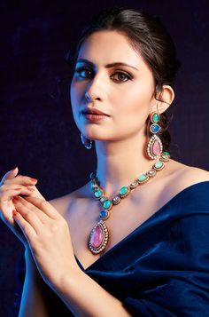 Elegantly blending classic and contemporary styles, this necklace set exudes a timeless and regal presence that is sure to capture attention. Perfect for any special occasion, its combination of traditional charm and modern elegance makes it the perfect accessory to elevate your ensemble. Finish: 22KT Gold Plating Material: Silver, Copper Alloy, Polki, Crystals Color: Multicolored Size: Free Size, Adjustable Closure Type: Draw String Box Contains: 1 Necklace, 1 Pair Earrings