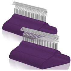 two purple combs sitting next to each other