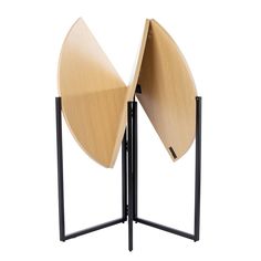 two circular wooden tables with black metal legs and one has an open section on the side