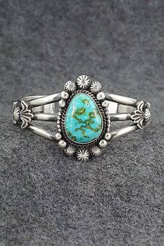 This stunning Sonoran Gold turquoise and sterling silver bracelet was made by Navajo silversmith Rosita Calladitto. The back is signed R Calladitto and stamped Sterling. Size: 5 3/4" (will fit up to a 6 3/4" wrist) Gap: 1" Width: 1 5/8" Cuff Width: 1/2" Free shipping on all orders! We ship with USPS and always include tracking. All orders ship within a day of payment. Returns are accepted up to 30 days after you receive your order. Just send us a message. Our shop offers cash back or store credi Artisan Turquoise Jewelry For Anniversary, Southwestern Style Jewelry With Polished Finish For Anniversary, Southwestern Style Polished Jewelry For Anniversary, Unique Engraved Turquoise Bracelets, Traditional Stamped Turquoise Jewelry, Southwestern Turquoise Jewelry For Anniversary, Artisan Turquoise Engraved Bracelets, Turquoise Stamped Bangle, Classic Turquoise Adjustable Bracelet