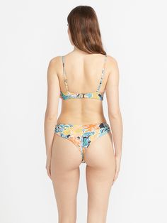 Crafted with Repreve® recycled fabric and a soft jersey lining, Volcom's Take It Easy Cheekini Bikini Bottom is a cheeky style that combines a fun-loving floral print, a mid-rise waist, and a high-leg cut to compliment your curves. -   - 74% Recycled Repreve Polyester / 26% Elastane Jersey  - Pull on Cheekini Bottom with center back seam  - Cheeky coverage  - Volcom logo metal badge at wearer's back right hip Volcom Logo, Swim Sets, Take It Easy, Printed Swim, Cheeky Bikinis, Pant Shirt, Jeans Brands, Recycled Fabric, V Neck Tops