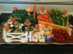 a tray filled with vegetables on top of a stove