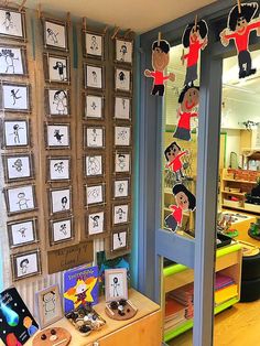 the children's room is decorated with paper cutouts and pictures on the wall