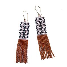 These beaded fringe earrings have a bold patterned top that flows to swingy fringe. Great day into night style! Glass beads with a gold-plated ear wire. 3.25" long. Made by artisans in Guatemala Artisan Fringe Dangle Earrings, Artisan Beaded Fringe Dangle Earrings, Artisan Fringe Drop Earrings, Fringe Dangle Chandelier Earrings, Artisan Dangle Tassel Earrings With Fringe, Artisan Fringe Tassel Dangle Earrings, Artisan Fringe Dangle Jewelry, Artisan Tassel Dangle Earrings With Fringe, Artisan Dangle Fringe Jewelry