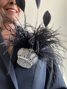 Stunning hand made royal coronation brooch. Black and Silver crown pendant. Black Ostrich Feathers Long black detailed feathers. Brooch pin. attachment. Receive in time for King Charlies Royal Coronation. Shipped in 1-2 days. Delivery to Europe within 3-8 working days Delivery to UK within 4-9 working days Delivery to USA within 10-18 working days Delivery to the rest of the world within 10-20 days. Luxury Black Brooch For Evening, Luxury Brooch Pins For Party, Black Brooch Pins For Evening, Luxury Black Wedding Brooches, Black Party Brooch Pins, Black Brooch Pins For Party, Black And Silver Crown, Royal Coronation, Royal Celebration