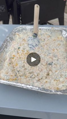 a metal pan filled with food on top of a table