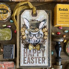 an assortment of items are displayed on a wooden surface with the words happy easter written in large letters