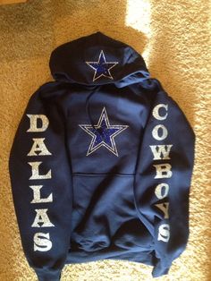 a hoodie with the word cowboys written on it and a star in the middle