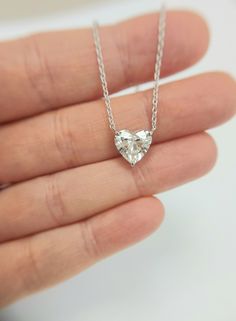 This is a beautiful Lab Grown diamond design pendant. It is set in real solid 14Kt Gold and the chain is 14Kt Gold as well. You can choose if you want 14Kt White Gold, 14Kt Yellow Gold or 14Kt Rose Gold. Free Shipping Main Stone: 2.50 Carat Gold metal: 14k White Gold Diamond Shape: Heart Cut Clarity: VS2 Color: F Symmetry : Excellent  Polish: Excellent  Necklace length: 18 Inches All products comes with International Gemologist Certificates. Please feel free to contact me for any questions or details , gold upgrades, diamond upgrades etc' Guidance and Advice Our team is standing by ready to assist, advise and guide you through the process of purchasing the ring of your dreams! The chain is attached at the top so that the diamond sits comfortably on you when you wear it. This is the perfect White Heart-cut Diamond Solitaire Necklace, Heart-shaped Diamond Cut Necklace As Gift, Heart-shaped Solitaire Necklace With Diamond Accents As Gift, White Heart-shaped Diamond Cut Necklace, Heart-shaped Diamond Cut Necklace For Gift, Heart Necklace Diamond, Necklace For Girlfriend, Diamond Solitaire Necklace, Solitaire Necklaces