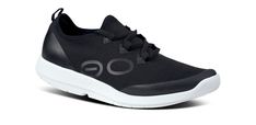 Please note: OOFOS recommends buying half a size up in this style. The OOmg Sport LS is an Active Recovery shoe built for a highly active day. Designed on the same foundation of OOfoam™ technology and patented footbed geometry as other OOFOS models. The midsole of the OOmg Sport LS is accentuated by a tapered sidewall, paired with our unique 4-way stretch FibreFlex upper that forms to your every move. The LS takes our athlete-inspired OOmg Sport and adds an integrated Lacing System, allowing for Active Recovery, Women Dress Collection, Black 13, Shoe Collection, Black Shoes, Womens Bottoms, White Black, Shoes Mens, Men's Shoes